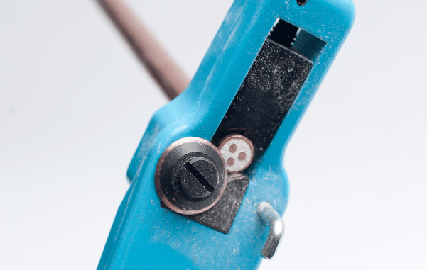 MICC cable being stripped using WMC cable stripper